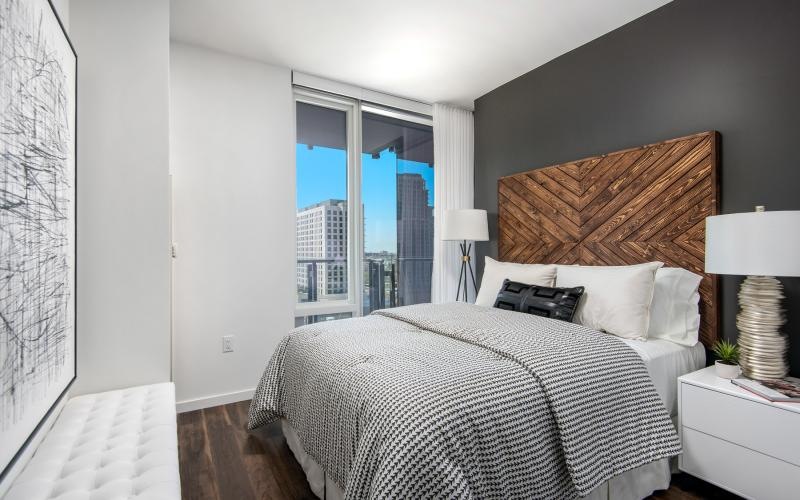 a bedroom with a large window