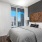 a bedroom with a large window