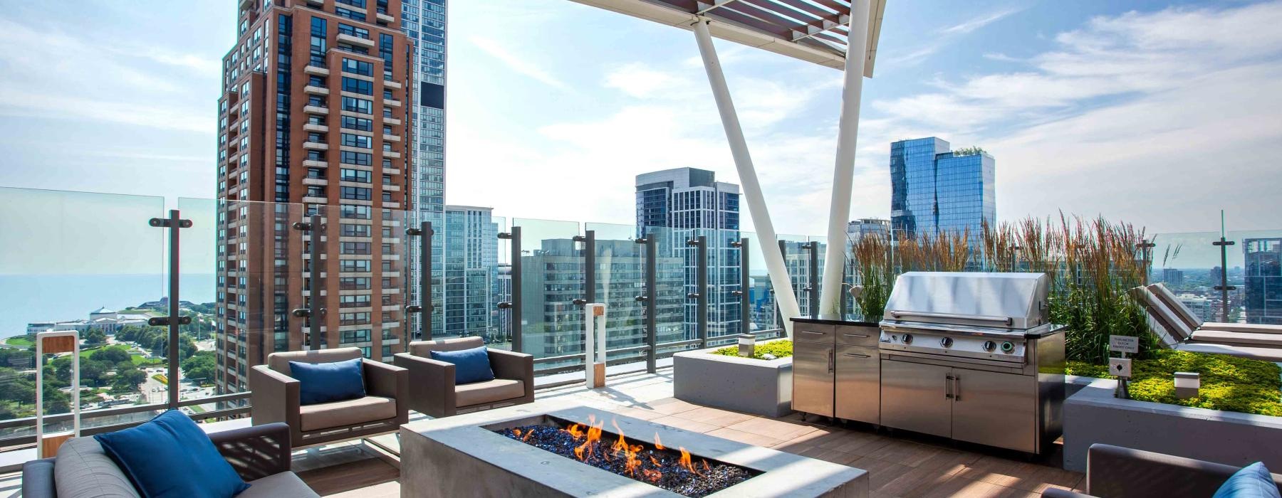 a room with a couch and a table with a view of a city