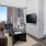 a living room with a tv and couches